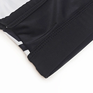 Detail of high-elastic black and white print swim briefs showing double-needle flat stitching