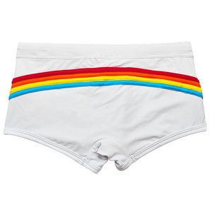 Detail of men's white swim trunks showing colorful rainbow stripes on the back view