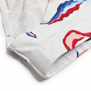 Detail of men's swim briefs featuring auspicious cloud print and precision stitching