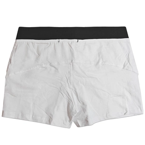 Detail view of cotton lounge shorts showing contrast black elastic waistband and white fabric
