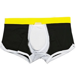 Detailed view of men's square-cut swimwear with yellow waistband and protective cup padding