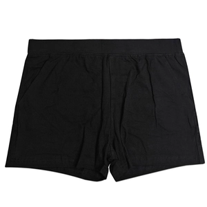 Detail of men's black cotton lounge shorts featuring elastic waistband and side pockets