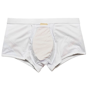 Detailed view of white men's swim trunks with built-in protective cup and elastic waistband