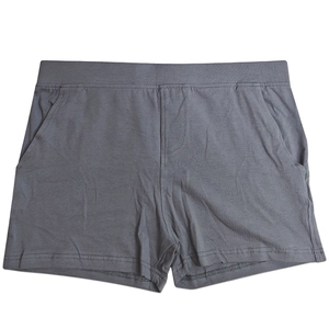 Close-up of elastic waistband and side pockets on dark gray cotton men's shorts
