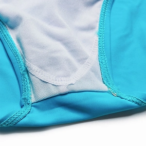 Detailed close-up of quick-dry men's swim briefs featuring fine stitching and mesh lining