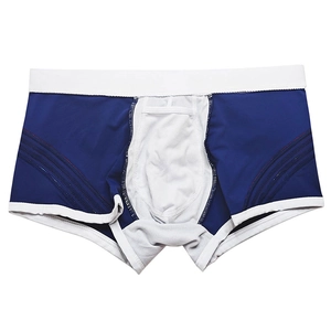 Detailed view of men's blue boxer trunks with breathable mesh pouch and red stitching