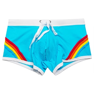 Close-up of sky blue men's swim trunks with rainbow side stripes and white drawstring waist