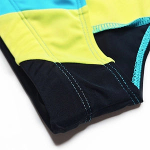 Macro detail of men's quick-dry swim briefs showing contrast stitching and tri-color fabric