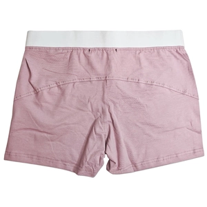 Detail of pink cotton lounge shorts featuring a wide white elastic waistband and back contour seams