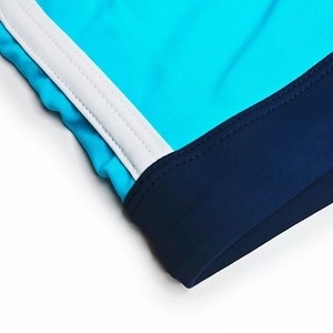 Detailed close-up showing the blue and white contrast stitching on elastic swim trunks