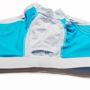 Detail view of men's blue swim trunks showing white U-convex breathable mesh lining