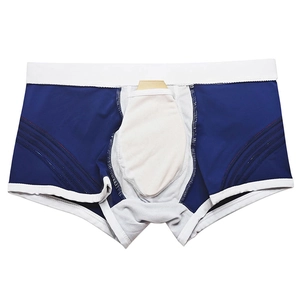 Detail of blue men's swim trunks with breathable 3D cup and white elastic waistband