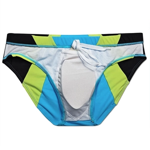 Close-up of men's color-block swim briefs with adjustable white drawstring and soft padding