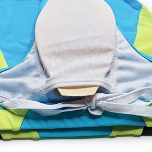 Detailed macro view of quick-dry swim briefs showing mesh lining and padding pocket