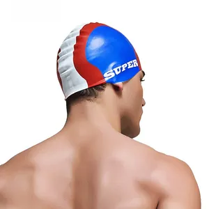 Detailed macro view of the tri-color silicone swim cap with bold blue red and white patterns