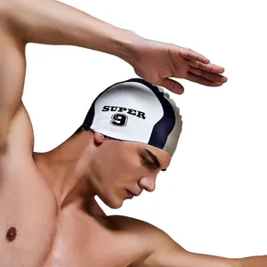 Detail view of tri-color silicone swim cap featuring SUPER 9 print on male athlete