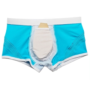 Detail view of men's swimming trunks featuring a protective cup insert and breathable fabric