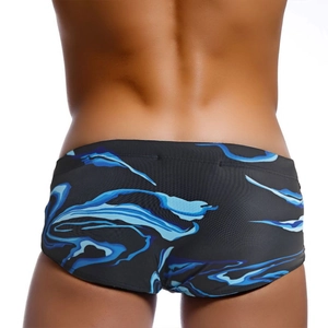 Mens digital marble print swim trunks in blue and black shown from a back view