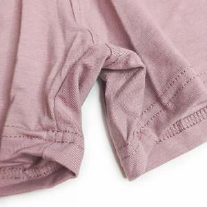 Detail of soft cotton men's boxer shorts showing fine double-stitch seams and fabric texture
