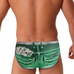 Detail of green denim print swim briefs with dollar bill pattern and back pocket design
