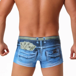 Detail view of denim print swim trunks for men with realistic dollar bill pattern on back