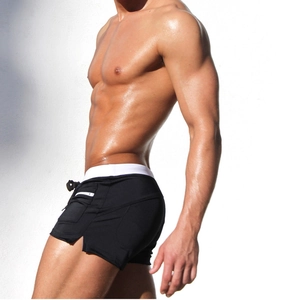 Men's quick-dry swim trunks side view showing practical zipper pocket and slim fit