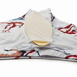 Detail view of removable padded cups and inner lining of printed swim trunks