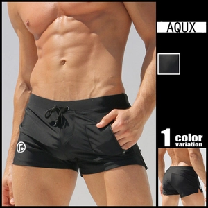 Detail view of men's black quick-dry swim trunks with zipper pocket and drawstring