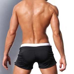 Rear view of men's quick-dry boxer swim trunks in black with white waistband detail