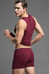 Detail view of burgundy knitted modal shorts with elastic waistband for men