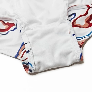 Macro detail of breathable lining and precision stitching on printed swimming trunks