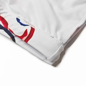 Macro detail of breathable mesh fabric with vibrant color printing and elastic seam