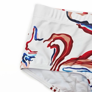 Macro shot of men's swimming trunks with abstract prints and high-quality elastic waistband