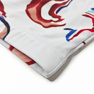 Close-up of abstract print swimwear fabric with durable double-needle stitching detail