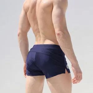 Men's navy blue quick-dry swim trunks with slim fit and side split athletic design