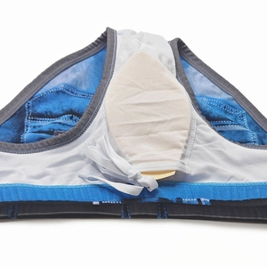 Detail view of men's swim trunks with denim print and built-in cup pocket