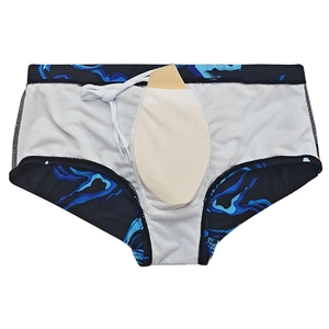 Detail view of men's marble print swim trunks showing internal lining and drawstring