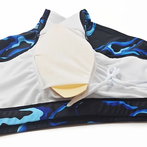 Detail of men's swimming trunks with marble print, mesh lining and removable foam pad