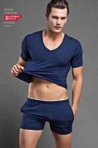 Detail of dark blue men's knitted modal loungewear set with V-neck tee and boxer shorts