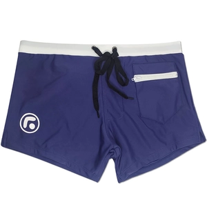 Detail view of men's blue swimming trunks featuring white zipper pocket and drawstrings