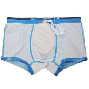 Detail of men's swim trunks featuring breathable white mesh lining and protective padded cup