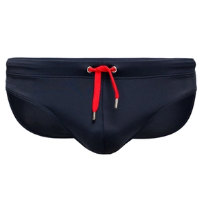 Close-up of navy blue men's swim briefs featuring red drawstring and metal aglets
