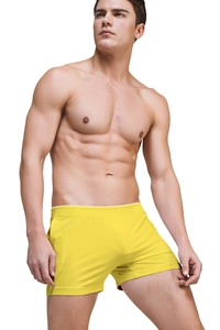 Detail of bright yellow modal lounge shorts for men with elastic waistband on athletic model