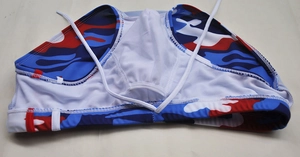 Detailed view of red and blue camo swim briefs showing breathable mesh lining and drawstring