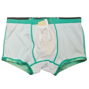 Detail view of men's swim trunks featuring a U-convex pouch and adjustable drawstring
