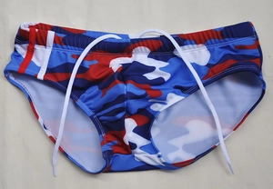Detail of men's camo swim briefs with red, blue and white pattern and drawstring
