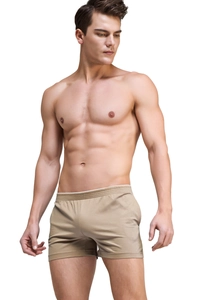 Close-up of soft modal fabric and elastic waistband on men's khaki lounge shorts