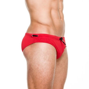 Detail of red men's swim briefs featuring black drawstring and high-elastic fabric