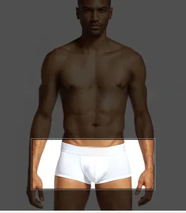 Detailed view of white cotton boxer briefs with U-convex pouch design on male model