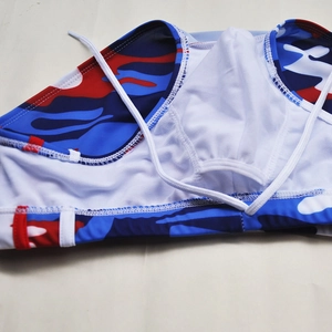 Detail of camo swim trunks showing white mesh lining, soft fabric, and adjustable drawstring
